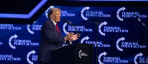 fact-check:-image-claims-to-show-donald-trump-holding-someone’s-hand-to-help-him-off-stage