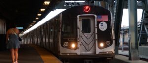 commuter-survives-after-being-pushed-onto-tracks-and-hit-by-train,-suspect-charged