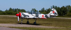 two-vintage-era-military-planes-collide,-1-dead