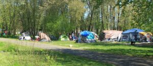 report:-police-break-up-homeless-encampment,-find-dead-body-stuffed-in-suitcase