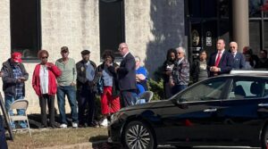 a-clueless-joe-biden-waits-in-line-to-vote-behind-guy-wearing-pro-trump-hat-with-special-message-to-voters-(video)-|-the-gateway-pundit-|-by-cristina-laila