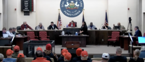 trump-supporters-stage-‘red-hat’-protest-over-council-president’s-kkk-accusations