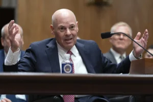 postmaster-general-visibly-covers-his-ears-amid-criticism-from-gop-lawmaker-–-washington-examiner