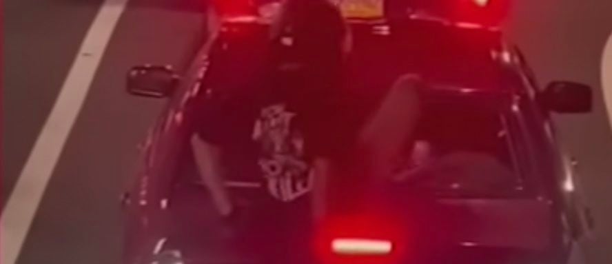 video-shows-reportedly-armed-philadelphia-motorcyclist-bashing-in-rear-windshield-of-car-with-kids-in-backseat