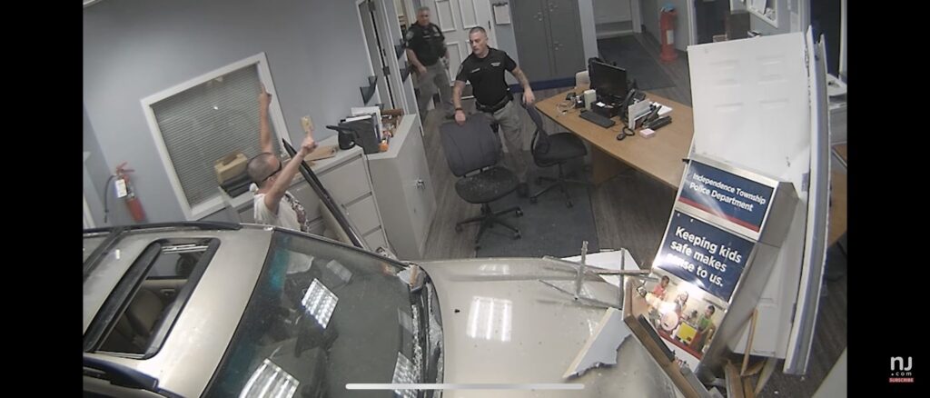 video-shows-man-apparently-slamming-car-into-police-station-while-blasting-‘welcome-to-the-jungle’