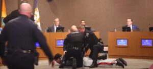 ex-nfl-player-dragged-away-by-police-after-minute-long-tirade-against-‘maga’