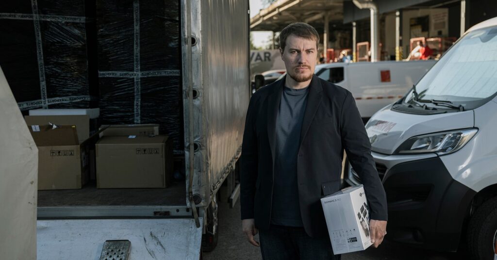 in-the-war-against-russia,-some-ukrainians-carry-ak-47s.-andrey-liscovich-carries-a-shopping-list