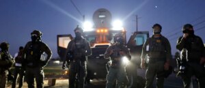 doj-charges-professor-who-allegedly-lobbed-tear-gas-at-ice-agents-during-raid