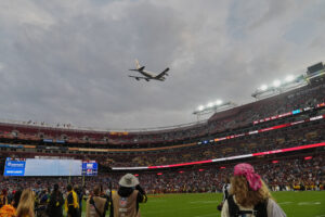 air-force-one-conducts-flyover-of-commanders-lions-game-as-trump-makes-history