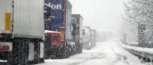 driver-rescued-after-truck-left-dangling-off-highway-bridge-during-heavy-snowfall