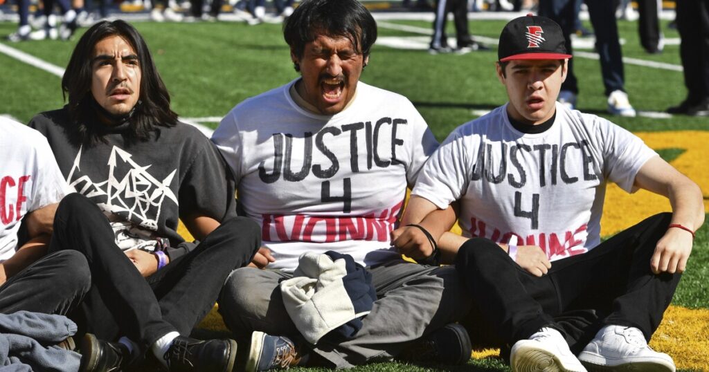 usc-cal-state-game-delayed-due-to-protesters-demonstrating-on-field