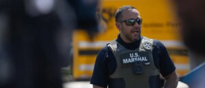 fugitive-hiding-under-child