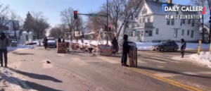 police-tear-down-anti-ice-road-blockade-after-masked-men-assault-reporter