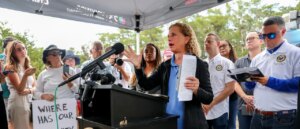debbie-wasserman-schultz-announces-run-for-mainly-black-district-with-obama-poster-in-background