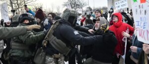 doj-charges-15-anti-ice-protesters-for