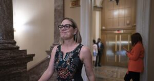 sinema-drops-hint-about-2024-plans-with-victory-lap-on-huge-spending-bill
