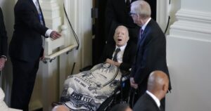 jimmy-carter-emerges-from-hospice-to-pay-tribute-draped-in-blanket-with-rosalynn’s-image