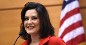 gov.-gretchen-whitmer-signs-voting-rights-legislation-for-ex-cons-and-teens