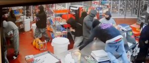 video-appears-to-show-car-crashing-into-bakery,-crowd-of-people-looting