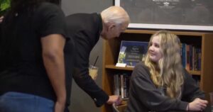young-girl-in-coffee-shop-recoils-after-biden-creeps-on-her-–-whispers-in-her-ear-(video)