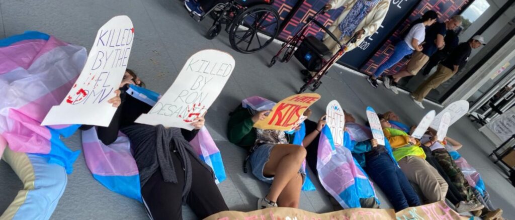 ‘ron-desantis-killed-me’:-protester’s-sign-goes-viral-after-florida-enacts-new-dmv-policy