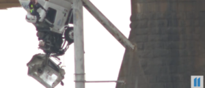 video-shows-first-responders-rescuing-semi-truck-driver-from-vehicle-dangling-off-bridge