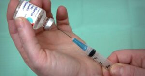 hospital-pays-job-applicant-who-refused-mandated-flu-shot