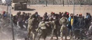 video-shows-illegal-migrants-overwhelming-texas-national-guard,-storming-border-wall