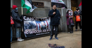 chicago-alderman-byron-sigcho-lopez-speaks-outside-city-hall-in-front-of-burned-american-flag