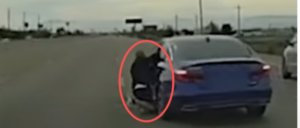 video-shows-cop-shooting-suspect-after-he-clings-to-vehicle-door-during-attempted-carjacking