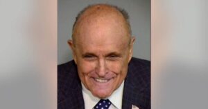 rudy-giuliani-smirks-in-mugshot-in-arizona-alternate-electors-lawfare-case